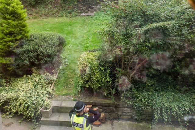The garden is being guarded by police. Picture: Ian Georgeson
