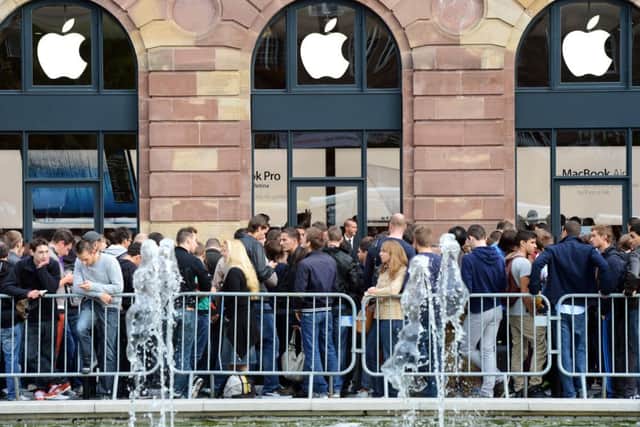 Eager customers wait for the opening of the Apple store in Strasbourg in 2012. Picture: Getty