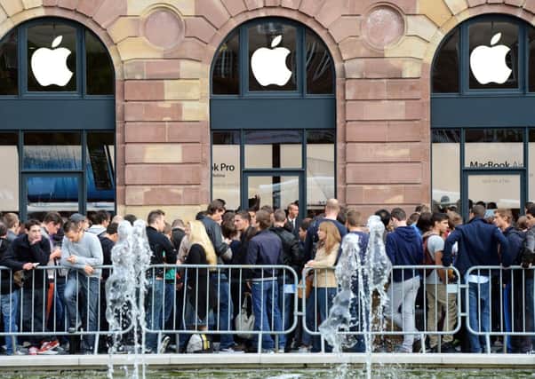 Eager customers wait for the opening of the Apple store in Strasbourg in 2012. Picture: Getty
