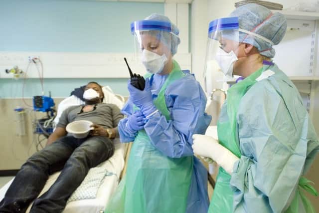 Workers are tested on their readiness for Ebola cases. Picture: PA
