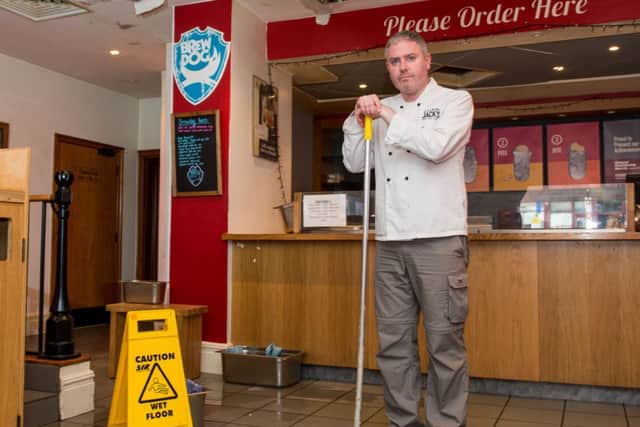 Jack Muir was forced to mop up after the restaurant was flooded