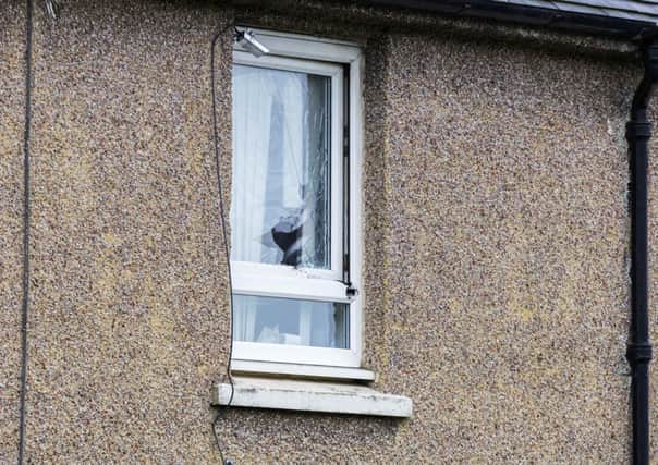 A window was smashed during the incident. Picture: Malcolm McCurrach