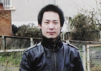 Jie Yu had operations on his hand and chest. Picture: Greg Macvean