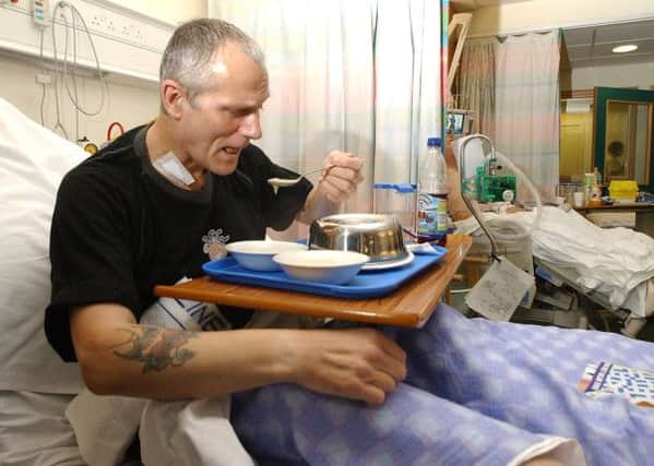 A patient tucks into his meal. Picture: Neil Hanna