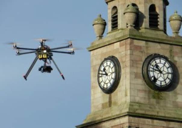 The hexacopter drone circles a building on inspection duty. Picture: comp