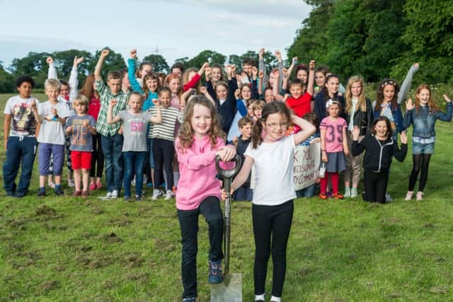 Campaigners celebrate winning the case to build the school on Portobello Park. Picture: Ian Georgeson