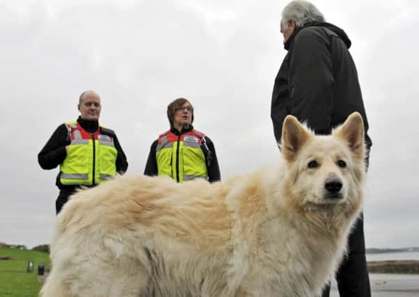 Edinburgh environmental wardens talk with a dog owner on the Cramond-Silverknowes prom. Picture: Phil Wilkinson