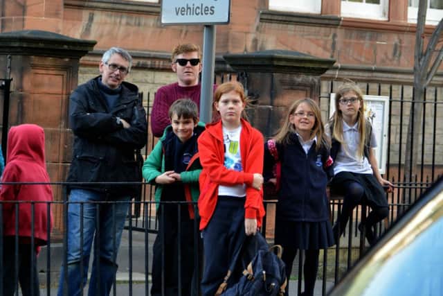Neil Cox, left, with families at Bruntsfield Primary. Picture: Jon Savage