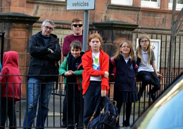 Neil Cox, left, with families at Bruntsfield Primary. Picture: Jon Savage