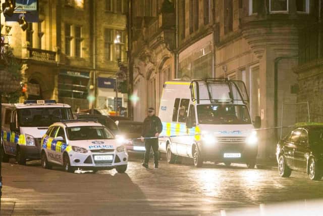 Police closed the Royal Mile and Cockburn Street for a major incident. Pic: Duncan McGlynn