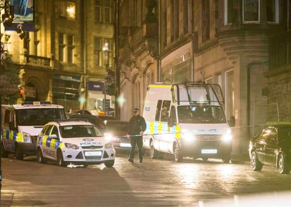 Police closed the Royal Mile and Cockburn Street for a major incident. Pic: Duncan McGlynn