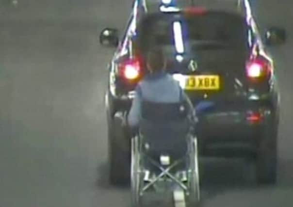 CCTV still of Maria Adams towing a pal in a wheelchair, during a crazy prank in a Sunderland supermarket.