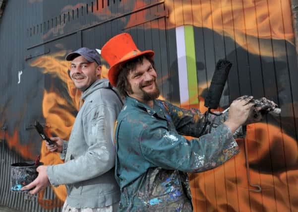 Painter Steve Anderson and artist Chris Rutterford prepare the archways on Market Street for  the graffiti art. Picture: Jane Barlow