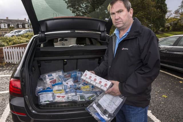 Former police officer Will OReilly with some illicit tobacco