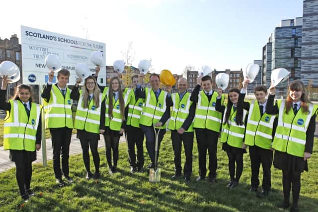 Alasdair Allan MSP cuts the first turf at the new Boroughmuir High site with pupils and headteacher David Dempster. Picture: Toby Williams