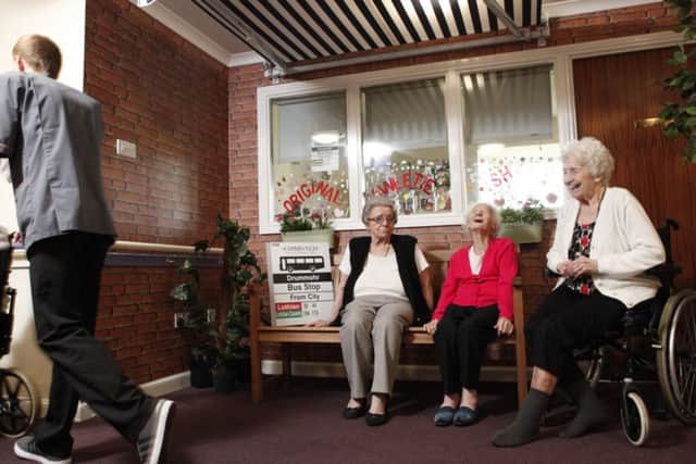 Residents enjoy a chat at Drummohr Care Homes bus stop. Picture: Toby Williams