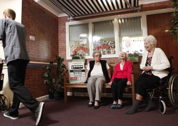 Residents enjoy a chat at Drummohr Care Homes bus stop. Picture: Toby Williams
