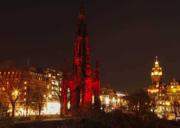 Tthe Scott Monument bathed in red light. Picture: Toby Williams