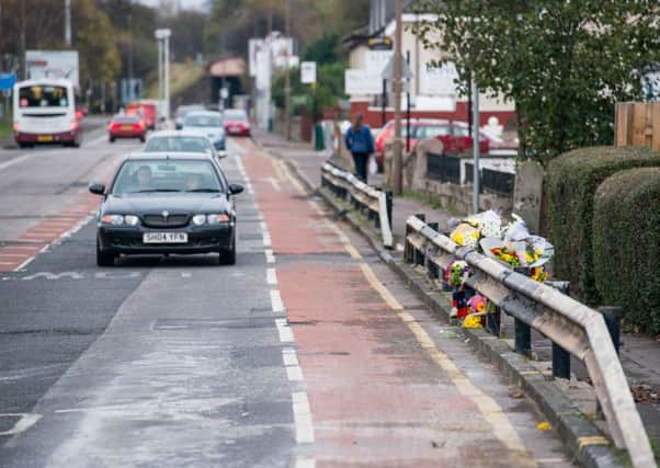 Flowers left at the scene of the crash. Picture: Ian Georgeson