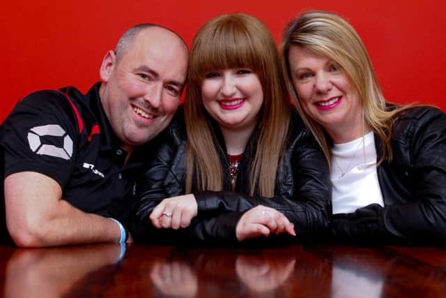Dad Paul Hughes, Shannon and mum Audrey. Picture: Scott Louden