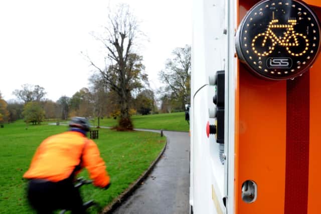 The sign lights up to warn cyclists if the vehicle is about to turn left. Picture: Lisa Ferguson