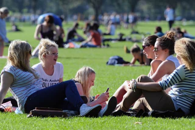 Students enjoy time out on the Meadows. Picture: Ian Rutherford