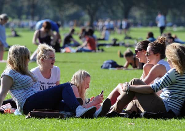 Students enjoy time out on the Meadows. Picture: Ian Rutherford