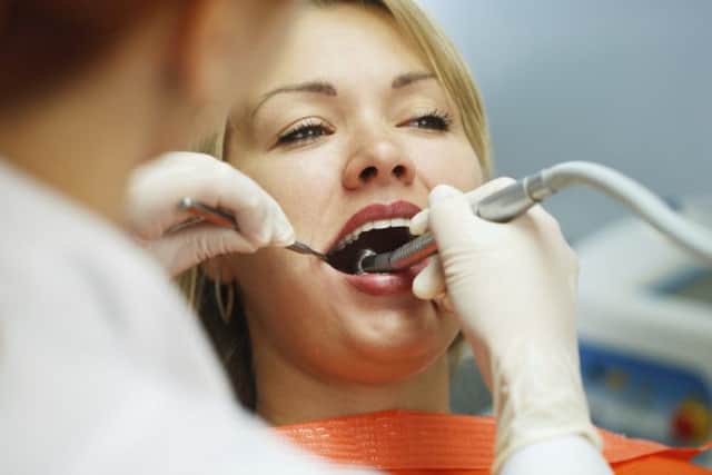 It is essential to have regular checks at a dentist as they are the most likely to spot signs of mouth cancer. Picture: PA