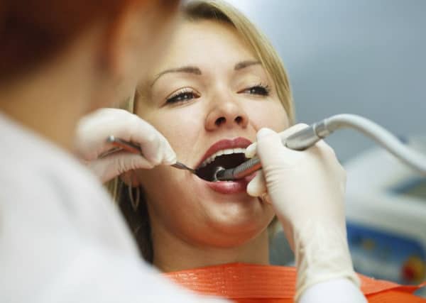 It is essential to have regular checks at a dentist as they are the most likely to spot signs of mouth cancer. Picture: PA