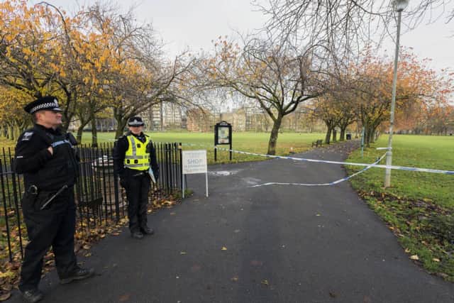 Police officers stand guard at Middle Meadow Walk as the investigation into the weekend rape continues. Picture: Malcolm McCurrach