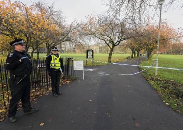 Police officers stand guard at Middle Meadow Walk as the investigation into the weekend rape continues. Picture: Malcolm McCurrach
