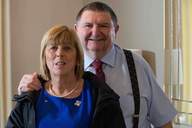 Jem and Bob with Mark's 'holey' jacket which she has kept as a memento. Picture: Alex Hewitt