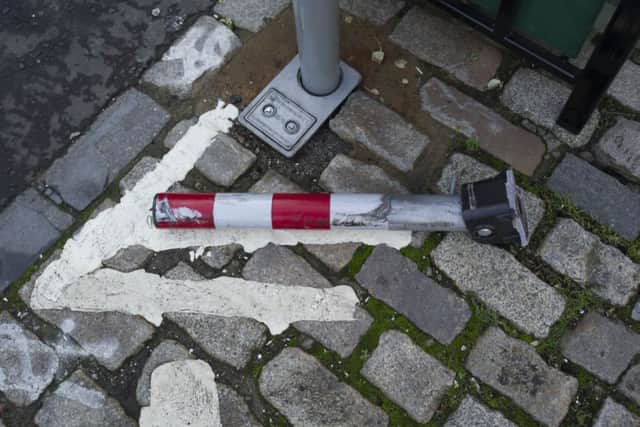 Seven out of eight bollards have been damaged by cars flouting the rules on George Street bike lane. Picture: Scott Taylor