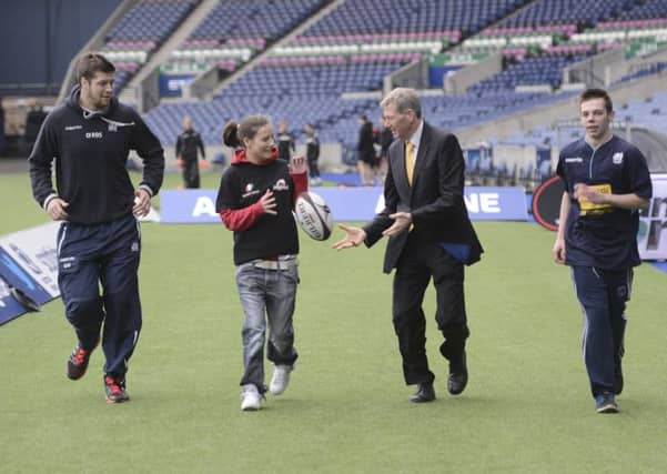Mr MacAskill with tutors and participants in the rugby scheme. Picture: Julie Bull