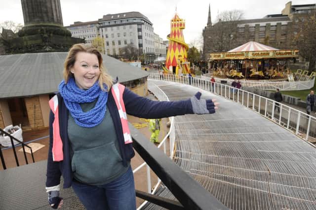 Lauren Dyer from Underbelly checks progress on St Andrew Square ice rink. Picture: Greg Macvean
