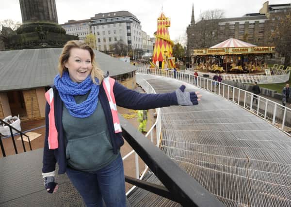 Lauren Dyer from Underbelly checks progress on St Andrew Square ice rink. Picture: Greg Macvean