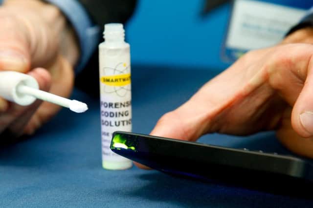 Smartwater, an invisible forensic coding liquid which shows up under a UV light.