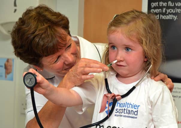 Getting the flu vaccine can save lives; below, Dr Nicola Steedman. Picture: Jon Savage