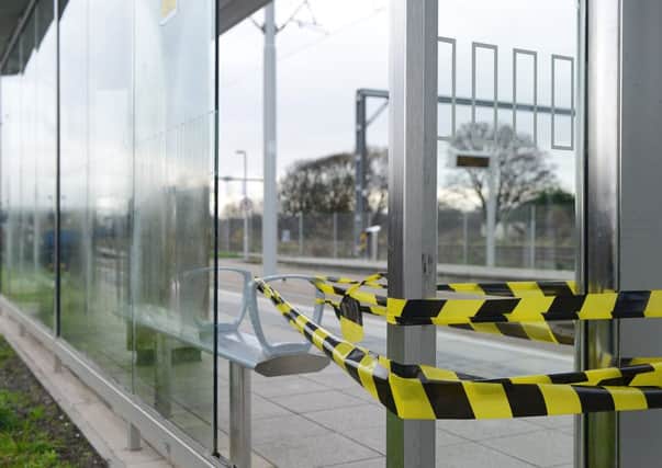 The tram shelter at Balgreen has been damaged by bricks and is now taped off. Picture: Neil Hanna