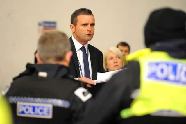 Detective Superintendent Patrick Campbell briefs officers before the operation this morning. Picture: Lisa Ferguson
