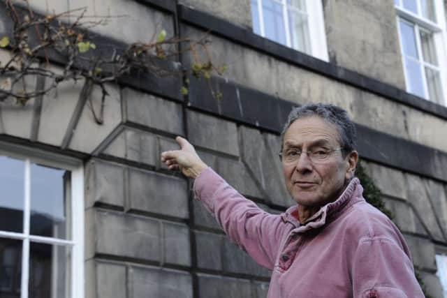 Stockbridge resident Mike Williamson poses with his grapes. Picture: Andrew O'Brien