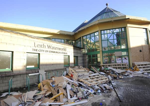 Wood and plaster piled up at Waterworld. Picture: Greg Macvean
