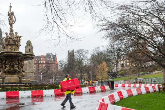 A race track is being created in Princes Street Gardens ahead of an event featuring Formula 1 stars Jenson Button and Mika Hakkinen. Pic: Ian Georgeson,