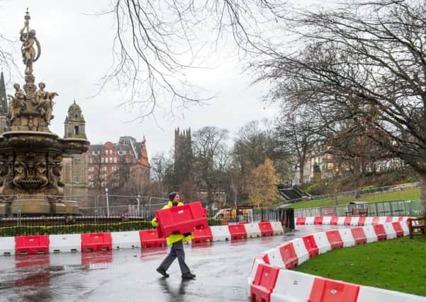 A race track is being created in Princes Street Gardens ahead of an event featuring Formula 1 stars Jenson Button and Mika Hakkinen. Pic: Ian Georgeson,