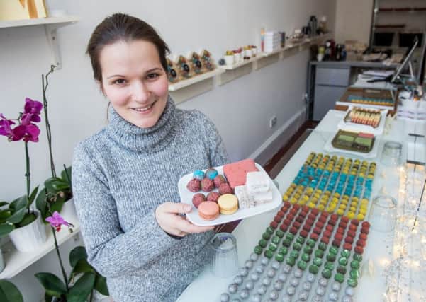 Maggie Simak with some of the delicious pastries on offer in Zukr Boutique in the citys Salisbury Place. Picture: Ian Georgeson