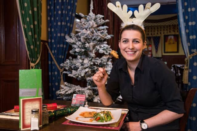 Waitress Ela Lelek Ralowska with some of the restaurants Cumin Flavoured Minced Reindeer