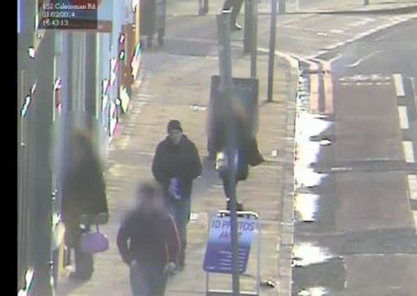 Police are keen to speak to the man in the purple gloves. Picture: Police Scotland