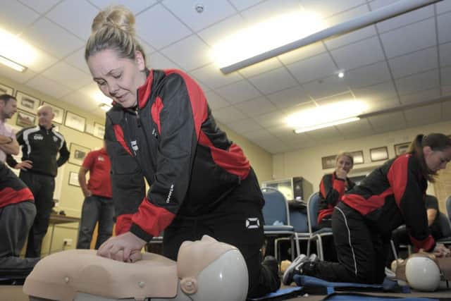 Staff at at Inch Park Community Sports Centre practice using defibrillators at a demonstration by St Johns Ambulance Service. Picture: Ian Rutherford