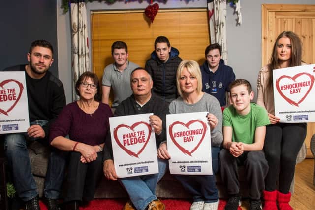 Jamie Skinner's family with the appeal poster. Pic: Ian Georgeson