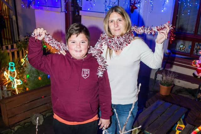 Libby Caldwell with son Calum Tait at their Muirhouse Park home. Pictured: Ian Georgeson